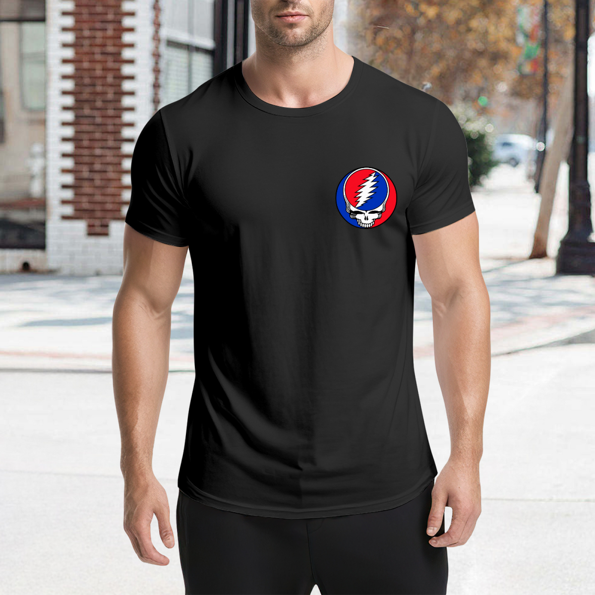 Graphic detail of Grateful Dead Steal Your Face left chest graphic T-shirt on a black T-shirt