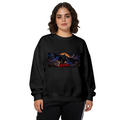 Studio photograph of a model in a women's crewneck sweatshirt showing a winged figure stretched across a wide eclipse-like backdrop