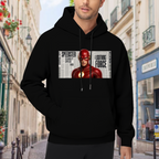 On-location model photograph displaying a scarlet-cowl portrait against a rectangular newspaper-style backdrop on the front of a men's hoodie