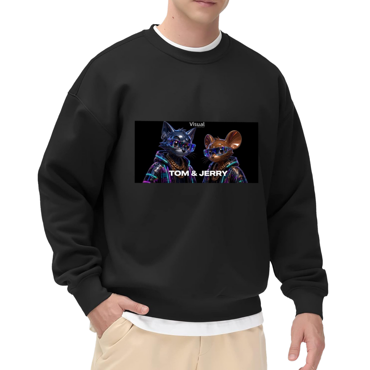 Studio photograph of a model in a men's crewneck sweatshirt showing a cartoon cat and mouse against a neon-toned backdrop