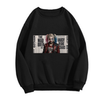 Women's crewneck sweatshirt photographed alone, with a pigtail portrait layered over rectangular newspaper-style lettering on the front