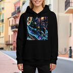 On-location model photograph displaying a whale traveling along curving trails of light through a galaxy on the front of a women's hoodie