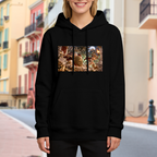 A shield-bearing figure in a detailed moonlit battle scene visible on a women's hoodie in an outdoor front model view