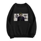 Men's crewneck sweatshirt photographed alone, with a suited clown portrait against a newspaper-style text collage on the front