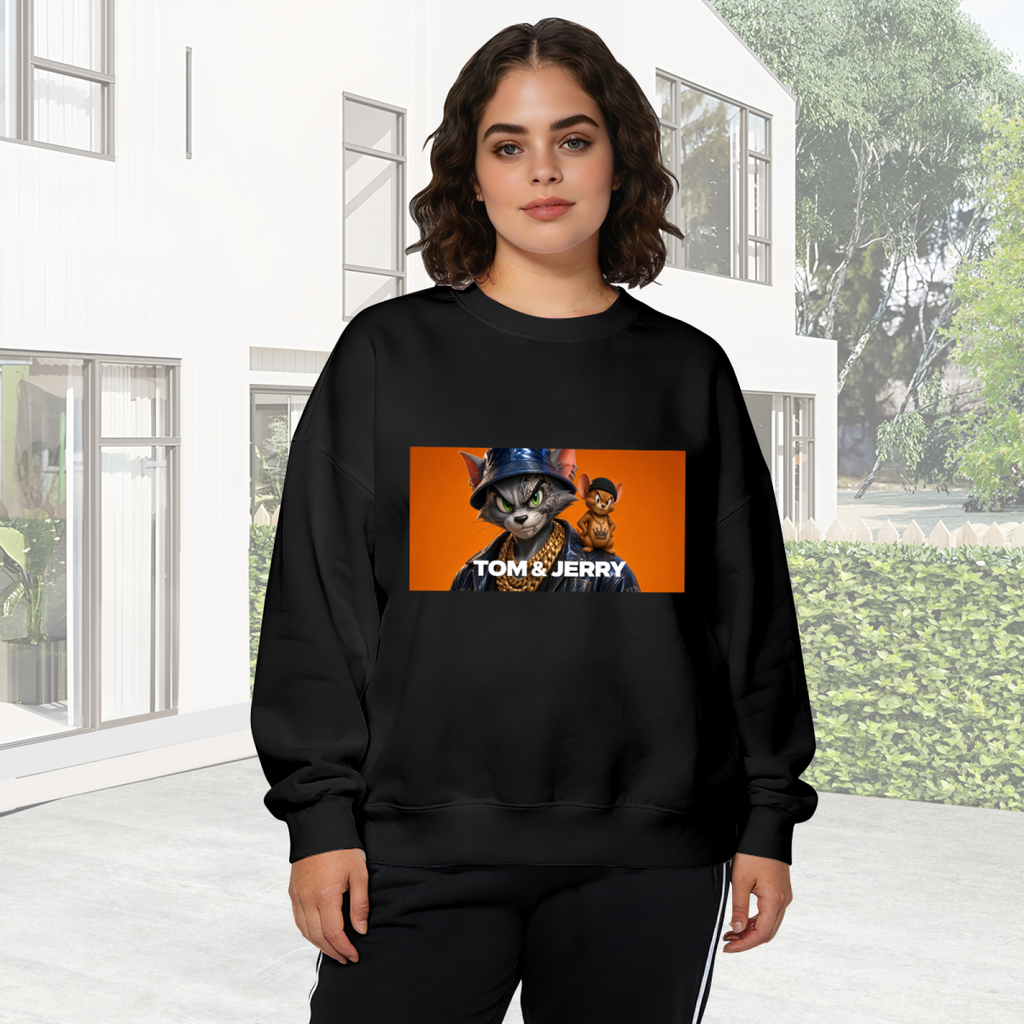 Outdoor photograph of a model in a women's crewneck sweatshirt bearing a cat wearing a bucket hat beside a mouse in a rectangular panel