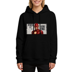 On-model product photo: women's hoodie bearing a scarlet-cowl portrait against a rectangular newspaper-style backdrop