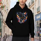 Lifestyle image outdoors: men's hoodie with a front graphic of a winged masked figure bursting through jagged multicolored paint strokes