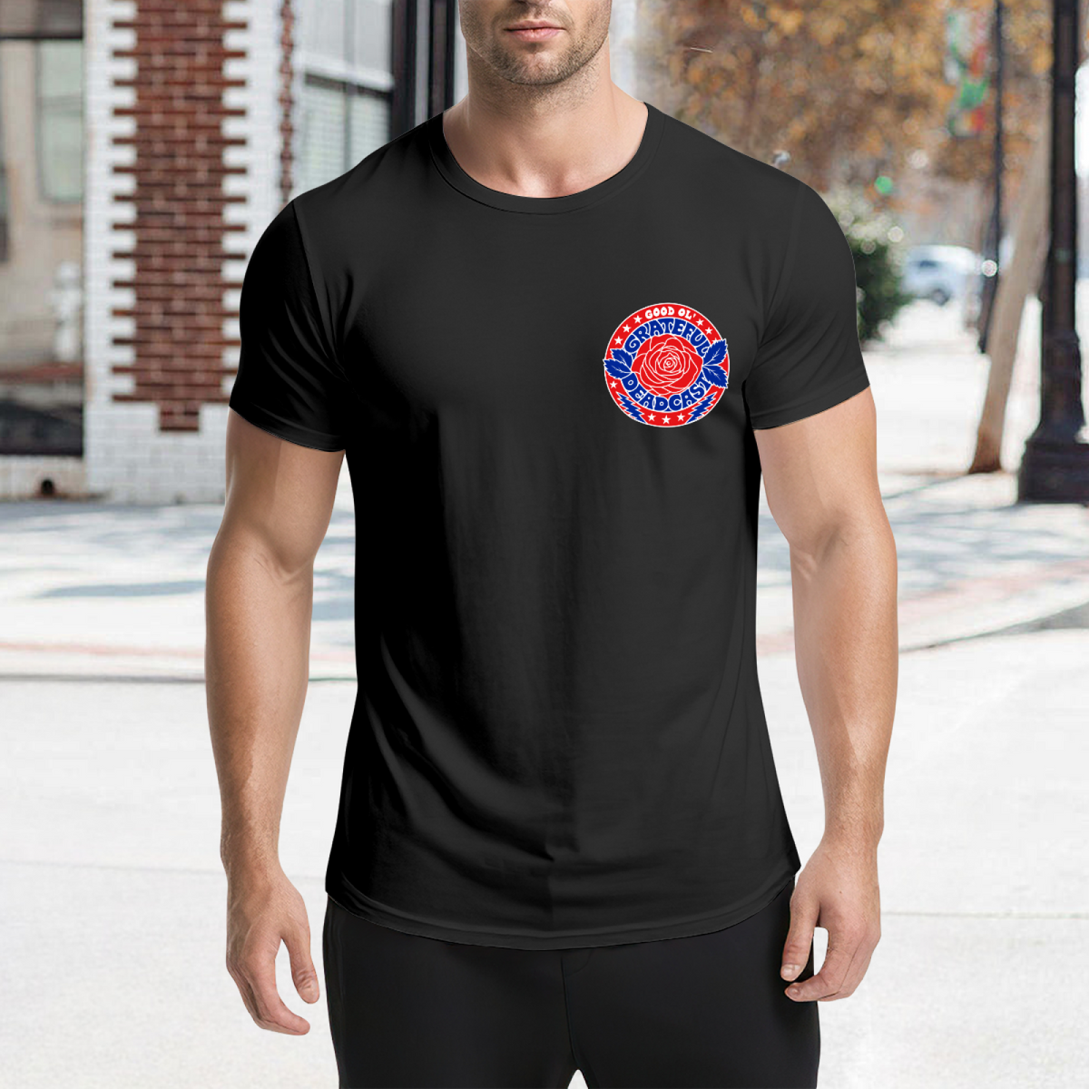 Graphic detail of Grateful Deadcast rose badge left chest graphic T-shirt on a black T-shirt