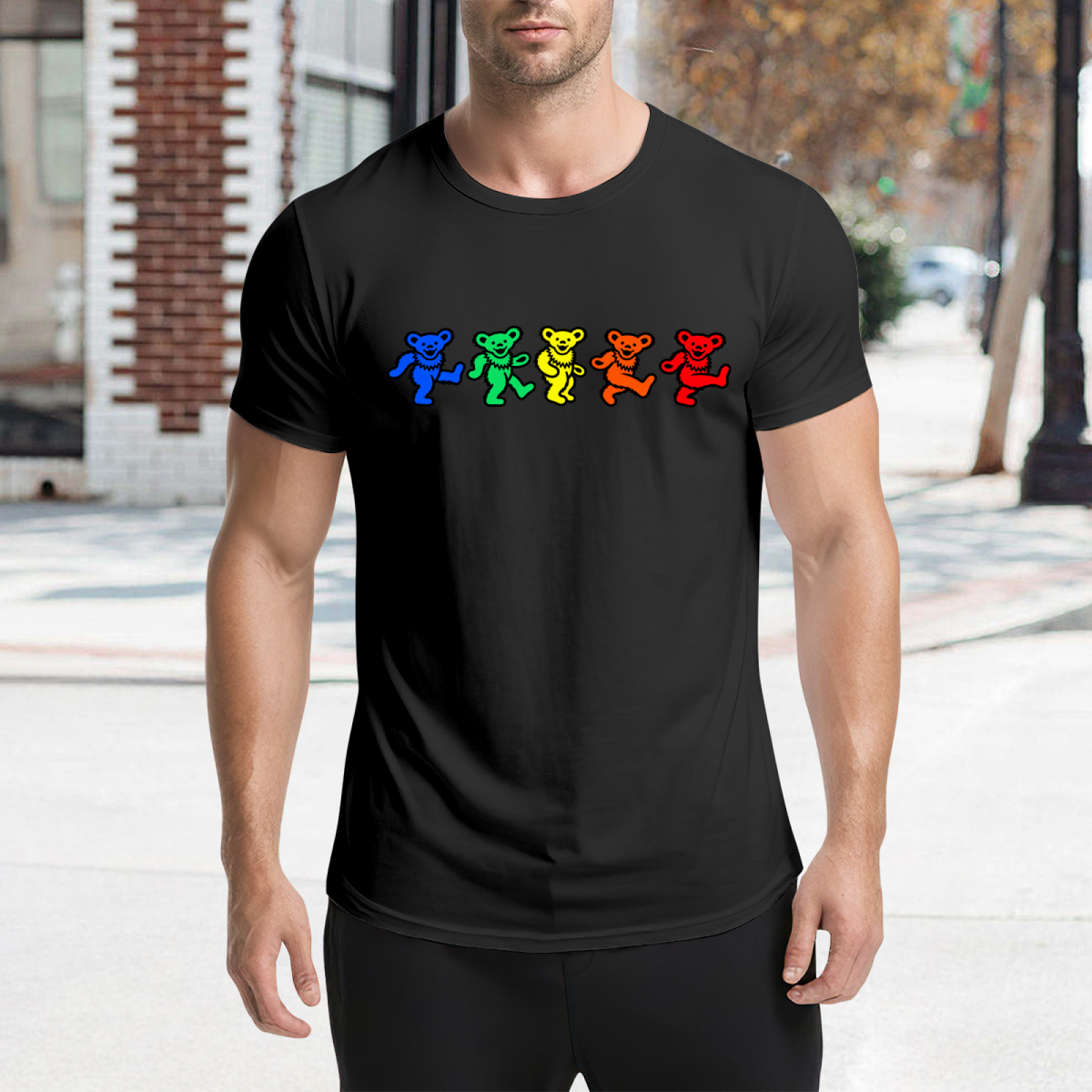 Graphic detail of Grateful Dead rainbow dancing bears graphic T-shirt on a black T-shirt