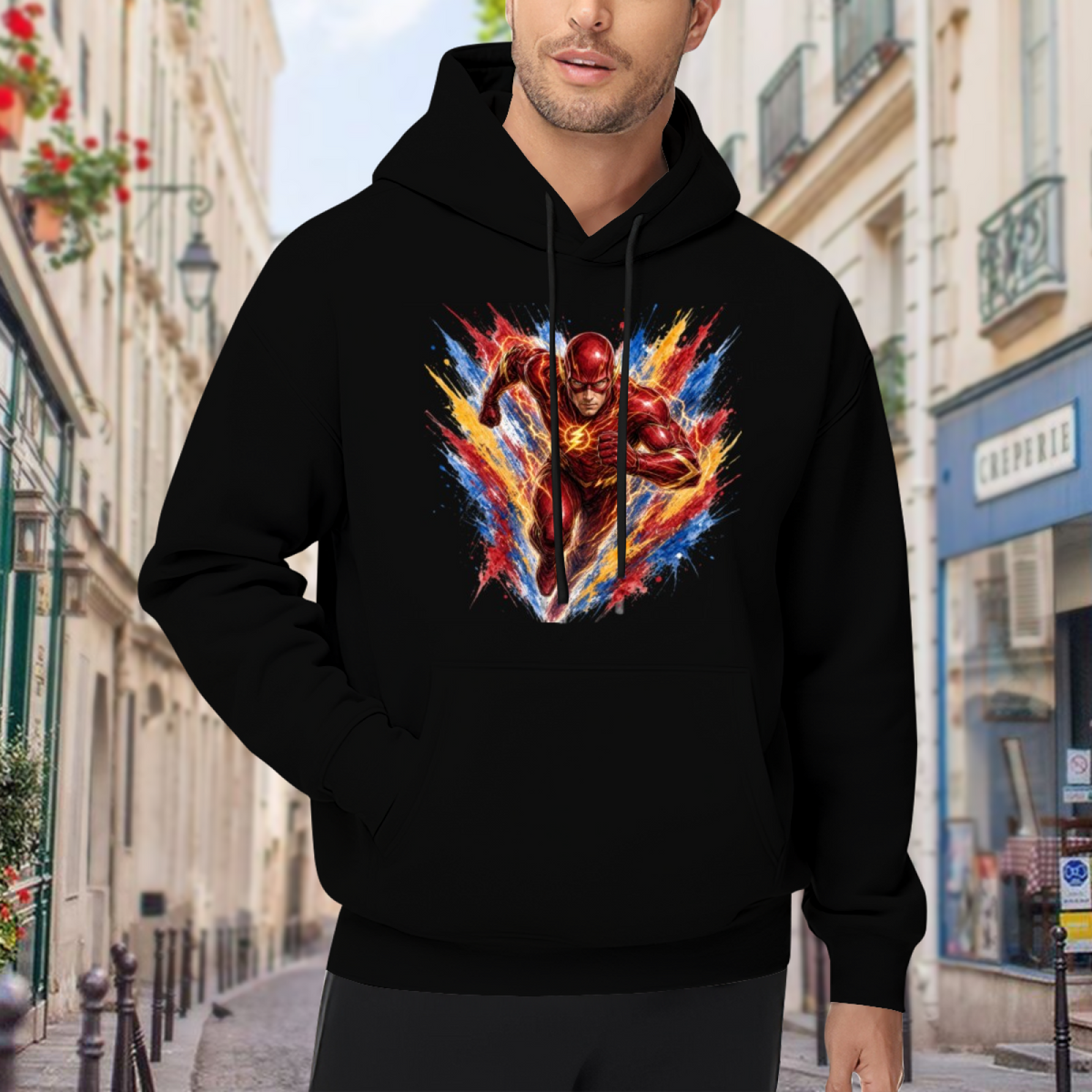 Lifestyle image outdoors: men's hoodie with a front graphic of a masked runner moving through an explosion of multicolored brushstrokes