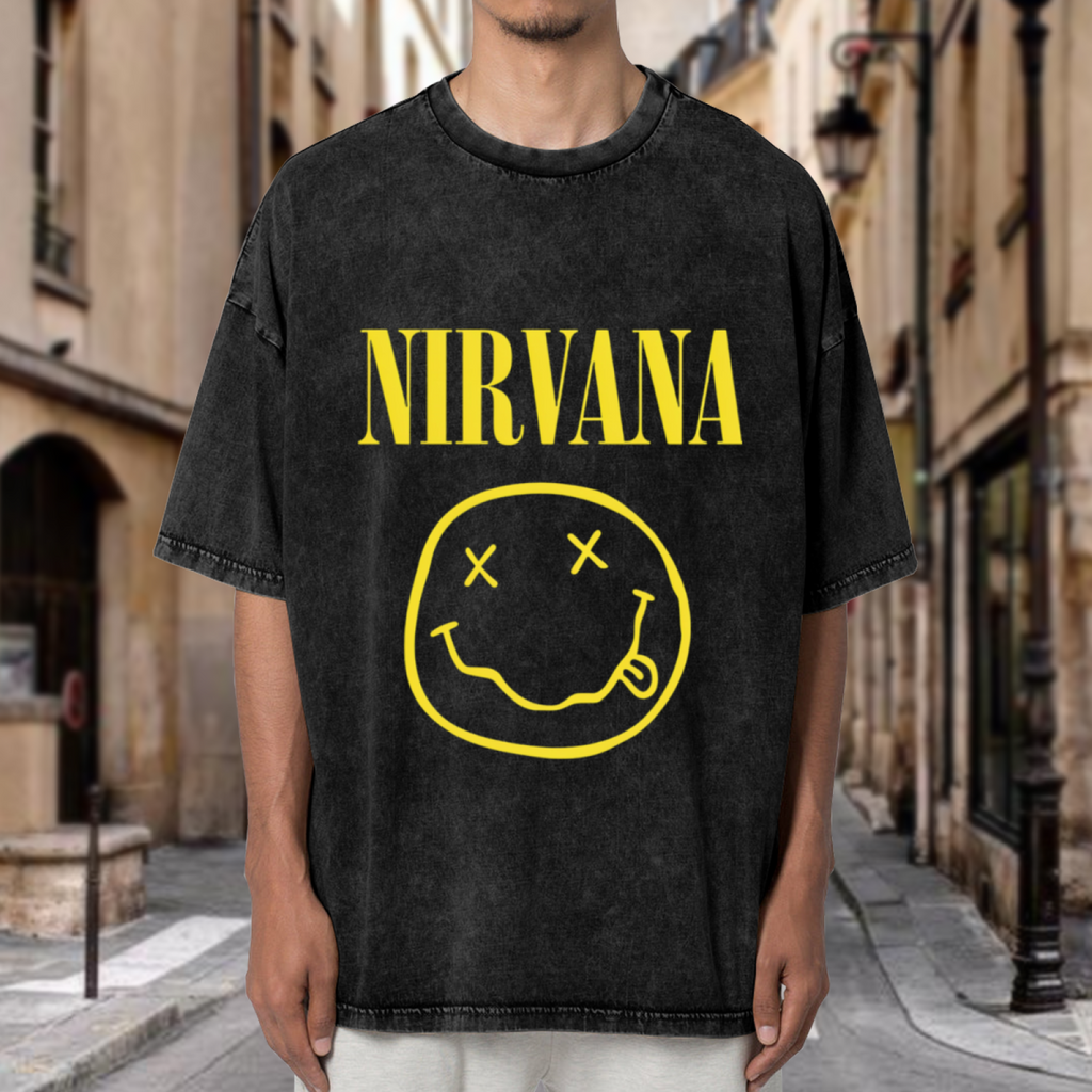 Nirvana Classic Smiley Logo Washed Tee in Black, product image showing the classic yellow Nirvana smiley-face logo in a grunge-inspired layout.