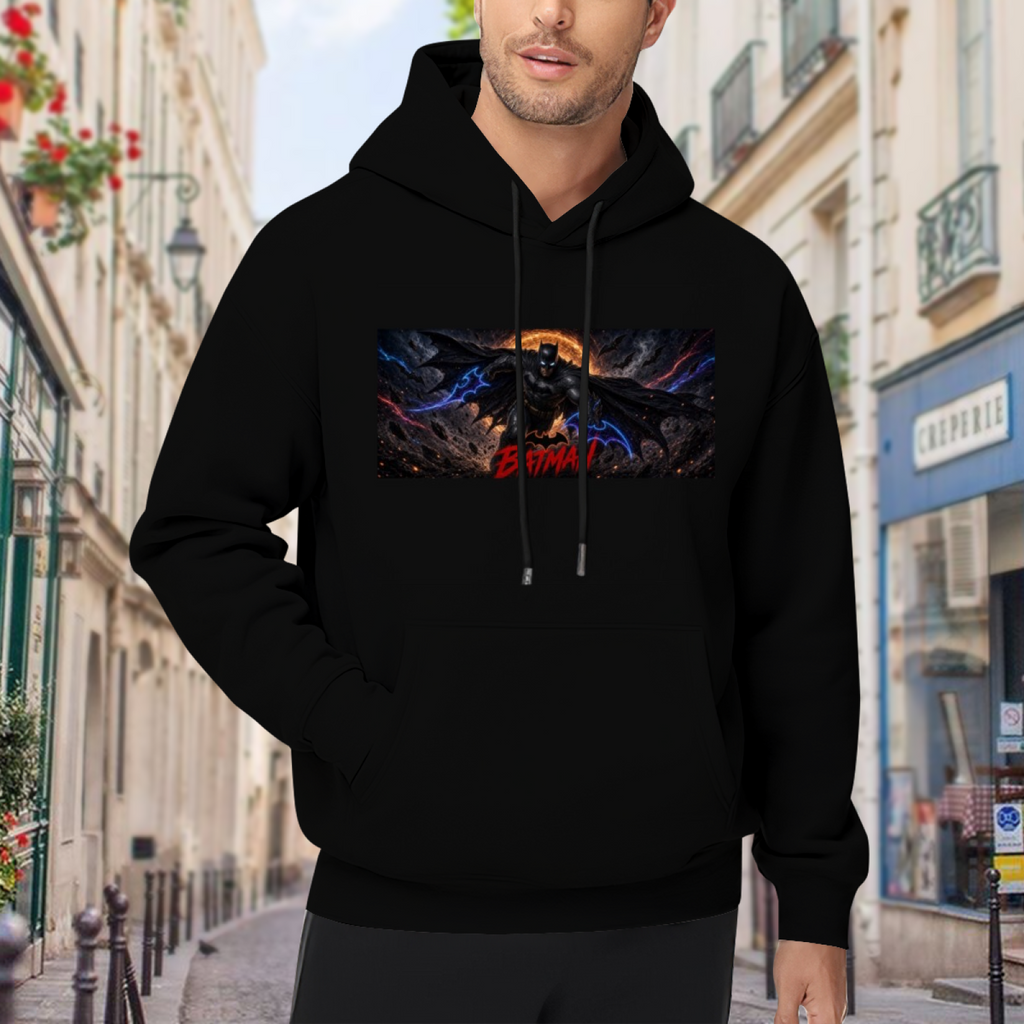 Lifestyle image outdoors: men's hoodie with a front graphic of a winged figure stretched across a wide eclipse-like backdrop