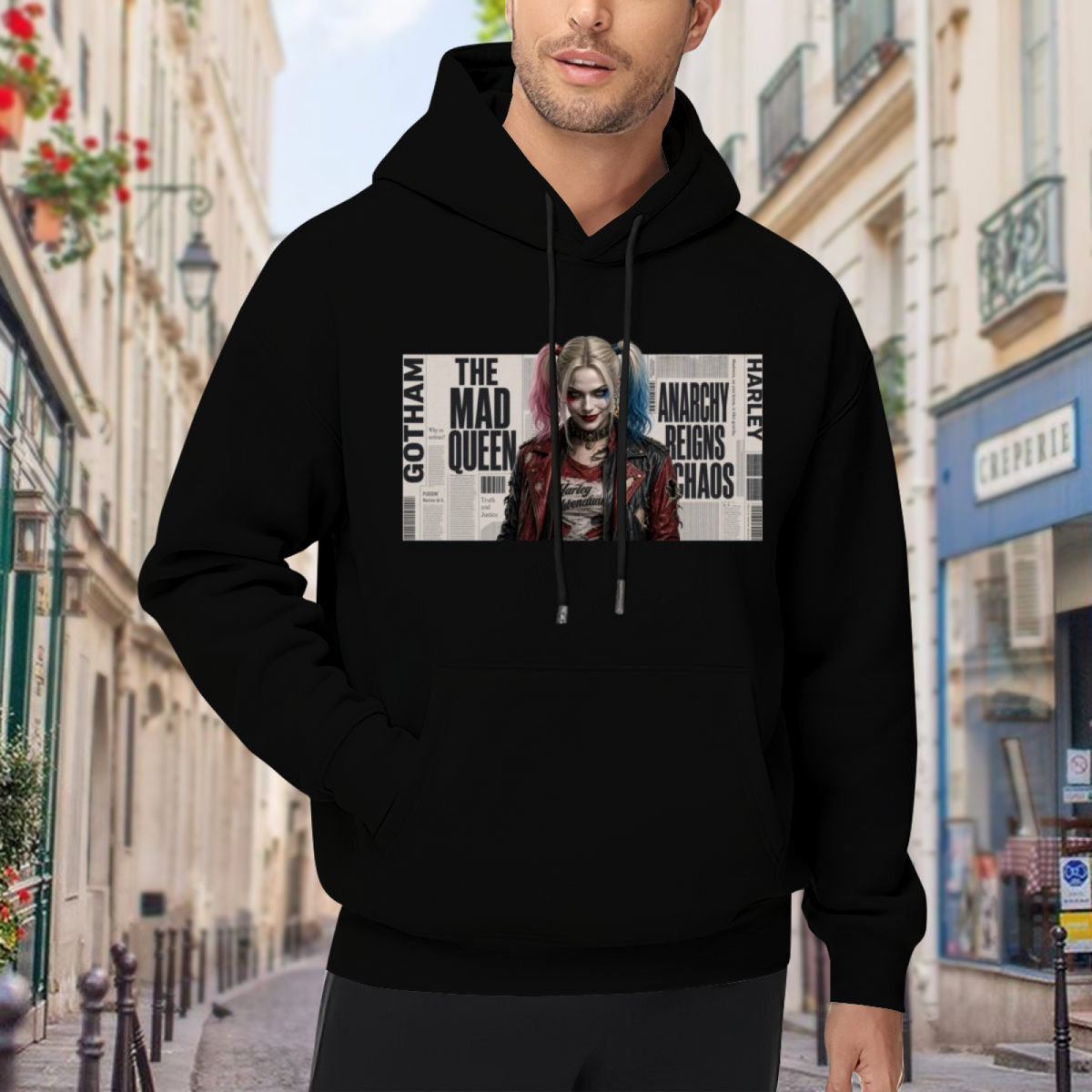 A pigtail portrait layered over rectangular newspaper-style lettering visible on a men's hoodie in an outdoor front model view