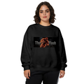 A running masked figure centered in a narrow lettered banner printed on a women's crewneck sweatshirt, shown in a front model photo