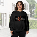 On-location model photograph displaying a running masked figure centered in a narrow lettered banner on the front of a women's crewneck sweatshirt