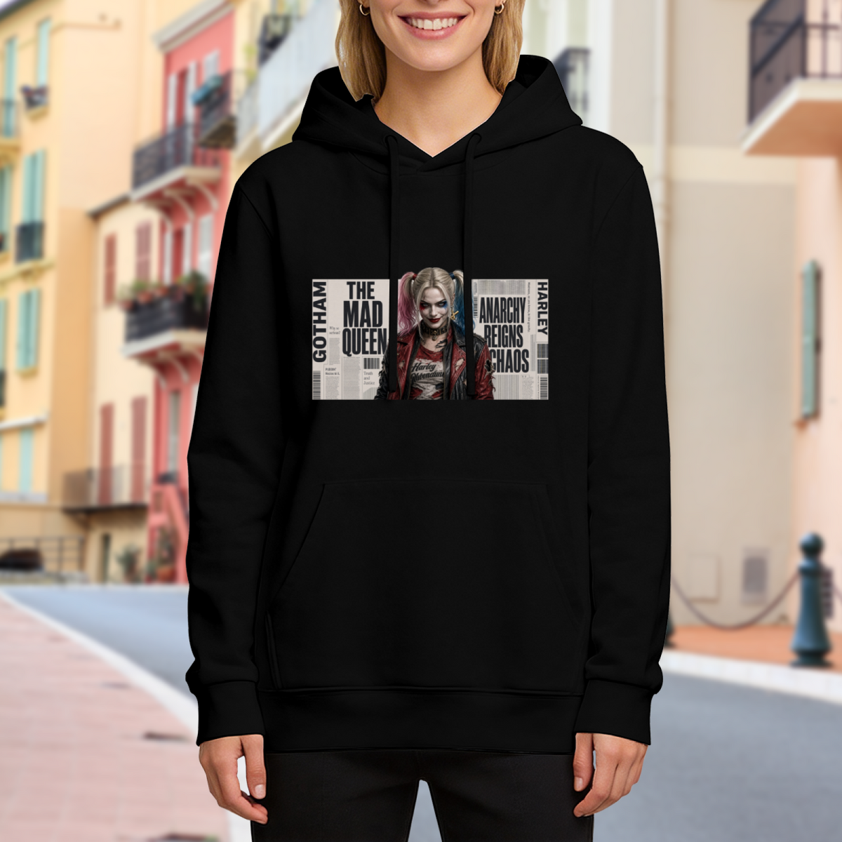 Women's hoodie worn outside, with the camera facing the graphic of a pigtail portrait layered over rectangular newspaper-style lettering