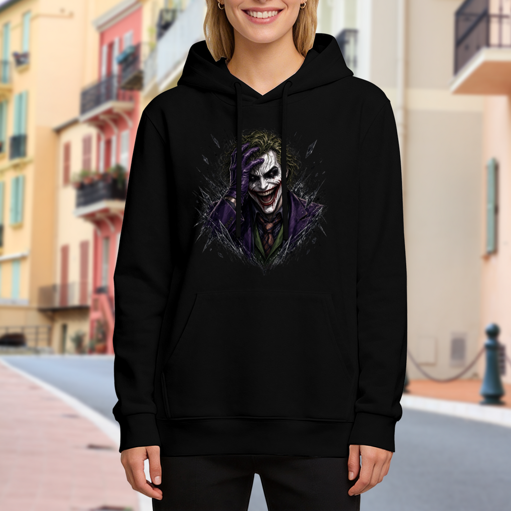 On-location model photograph displaying a grinning clown portrait framed by rough dark strokes on the front of a women's hoodie
