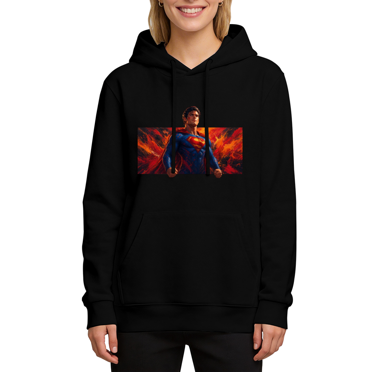 Front-facing model wearing a women's hoodie decorated with a caped figure in a wide portrait framed by flame-like color