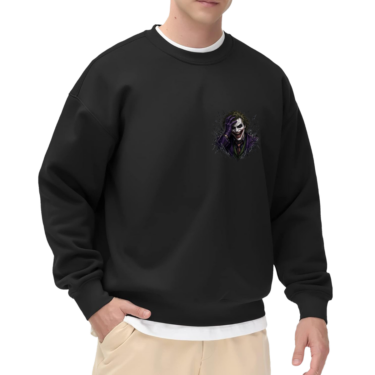 On-model product photo: men's crewneck sweatshirt bearing a grinning clown portrait framed by rough dark strokes