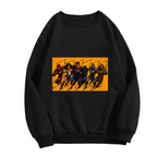 Unworn women's crewneck sweatshirt, front view of the design depicting a group of costumed figures charging across a warm-toned action panel