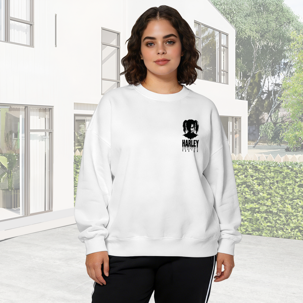 A compact pigtail silhouette with ink-style lettering visible on a women's crewneck sweatshirt in an outdoor front model view