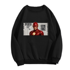 A scarlet-cowl portrait against a rectangular newspaper-style backdrop shown on the front of a men's crewneck sweatshirt in a standalone product shot