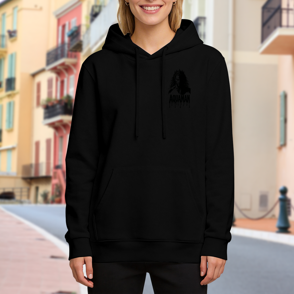 Lifestyle image outdoors: women's hoodie with a front graphic of a small crowned silhouette with dark ink-style lettering