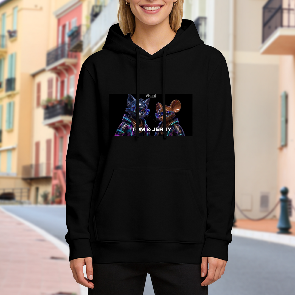 A cartoon cat and mouse against a neon-toned backdrop visible on a women's hoodie in an outdoor front model view