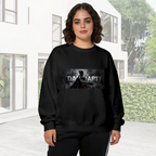 Women's crewneck sweatshirt worn outside, with the camera facing the graphic of an armored figure in a smoky grayscale panel with lettering