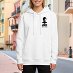 Women's hoodie worn outside, with the camera facing the graphic of a small clown silhouette and ink-style lettering