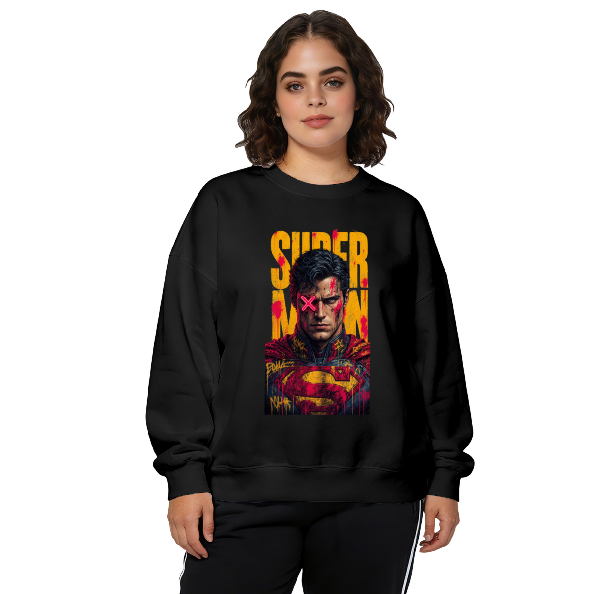 Front-facing model wearing a women's crewneck sweatshirt decorated with a tall caped graffiti portrait with a pink X across the eyes