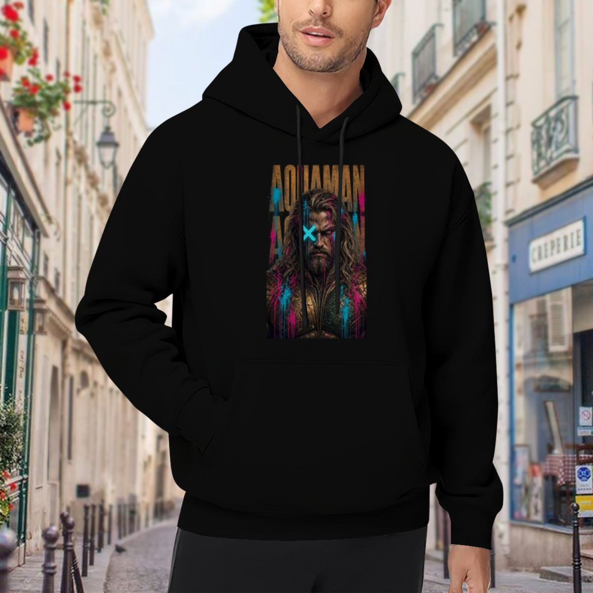 Men's hoodie worn outside, with the camera facing the graphic of a tall bearded graffiti portrait with a cyan X across the eyes