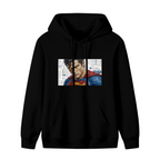 Women's hoodie photographed alone, with a tightly cropped intense face above a cape against newsprint on the front