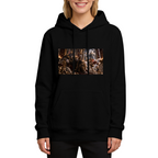 Studio photograph of a model in a women's hoodie showing a feline ruler in an ornate palace filled with storm effects