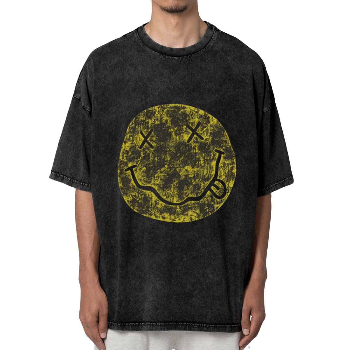 Nirvana Distressed Smiley Washed Graphic Tee in Black, product image showing a faded yellow Nirvana smiley-face graphic with a distressed finish.