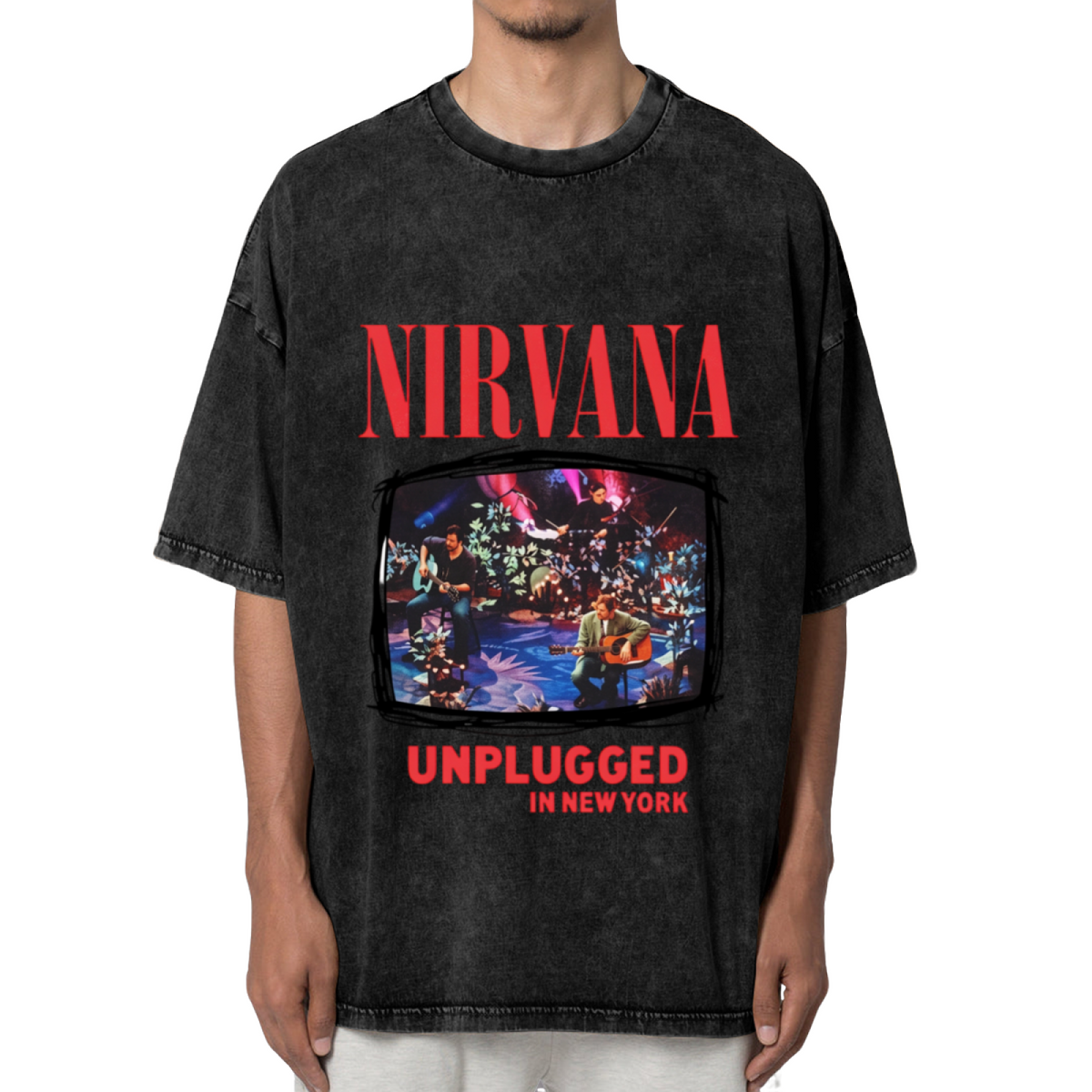 Nirvana MTV Unplugged New York Washed Tee in Black, product image showing nirvana’s MTV Unplugged in New York stage photograph framed by album-inspired lettering.