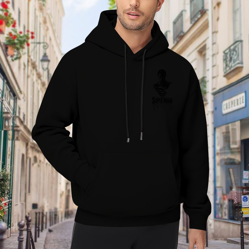 Outdoor photograph of a model in a men's hoodie bearing a small caped ink silhouette with lettering