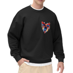 A flying caped figure amid sharp multicolored brushstrokes printed on a men's crewneck sweatshirt, shown in a front model photo