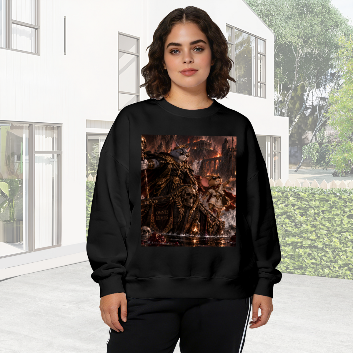 Lifestyle image outdoors: women's crewneck sweatshirt with a front graphic of an armored cat surrounded by flames in a detailed fantasy battle