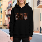 Women's hoodie worn outside, with the camera facing the graphic of an armored cat surrounded by flames in a detailed fantasy battle