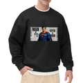 Studio photograph of a model in a men's crewneck sweatshirt showing a classic caped figure posed against a rectangular newspaper-style collage