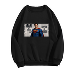 Standalone men's crewneck sweatshirt front displaying a graphic of a classic caped figure posed against a rectangular newspaper-style collage