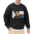 Front-facing model wearing a men's crewneck sweatshirt decorated with a tightly cropped intense face above a cape against newsprint