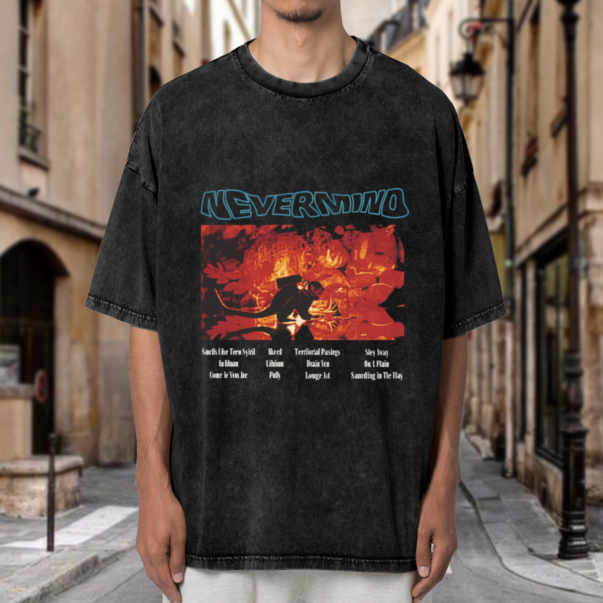 Nirvana Nevermind Concert Washed Graphic Tee in Black, product image showing a red concert-inspired Nevermind graphic featuring tracklist-style typography.