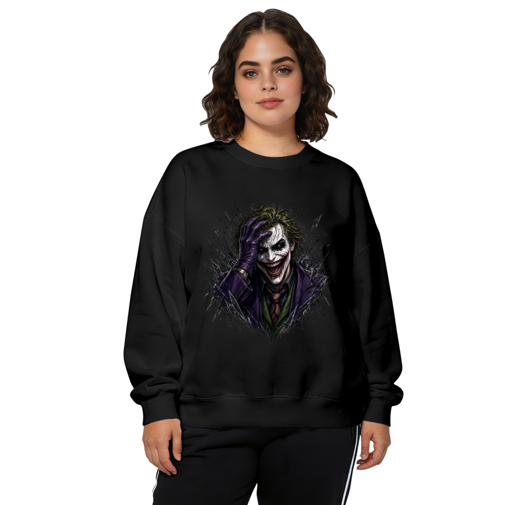 Front-facing model wearing a women's crewneck sweatshirt decorated with a grinning clown portrait framed by rough dark strokes