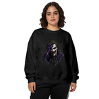 Front-facing model wearing a women's crewneck sweatshirt decorated with a grinning clown portrait framed by rough dark strokes
