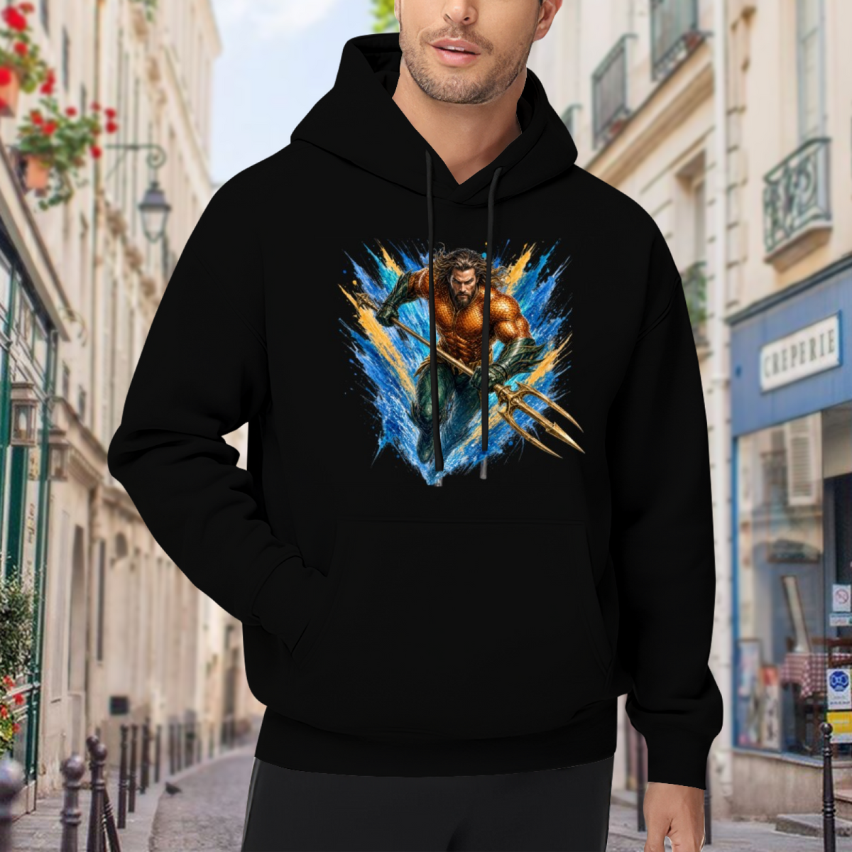 Outdoor photograph of a model in a men's hoodie bearing an armored trident bearer surrounded by sharp multicolored paint streaks
