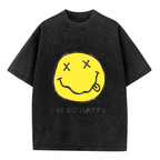 Nirvana Smiley Face Yellow Washed Tee in Black, product image showing a yellow smiley-face print associated with Nirvana and the words I’m So Happy.