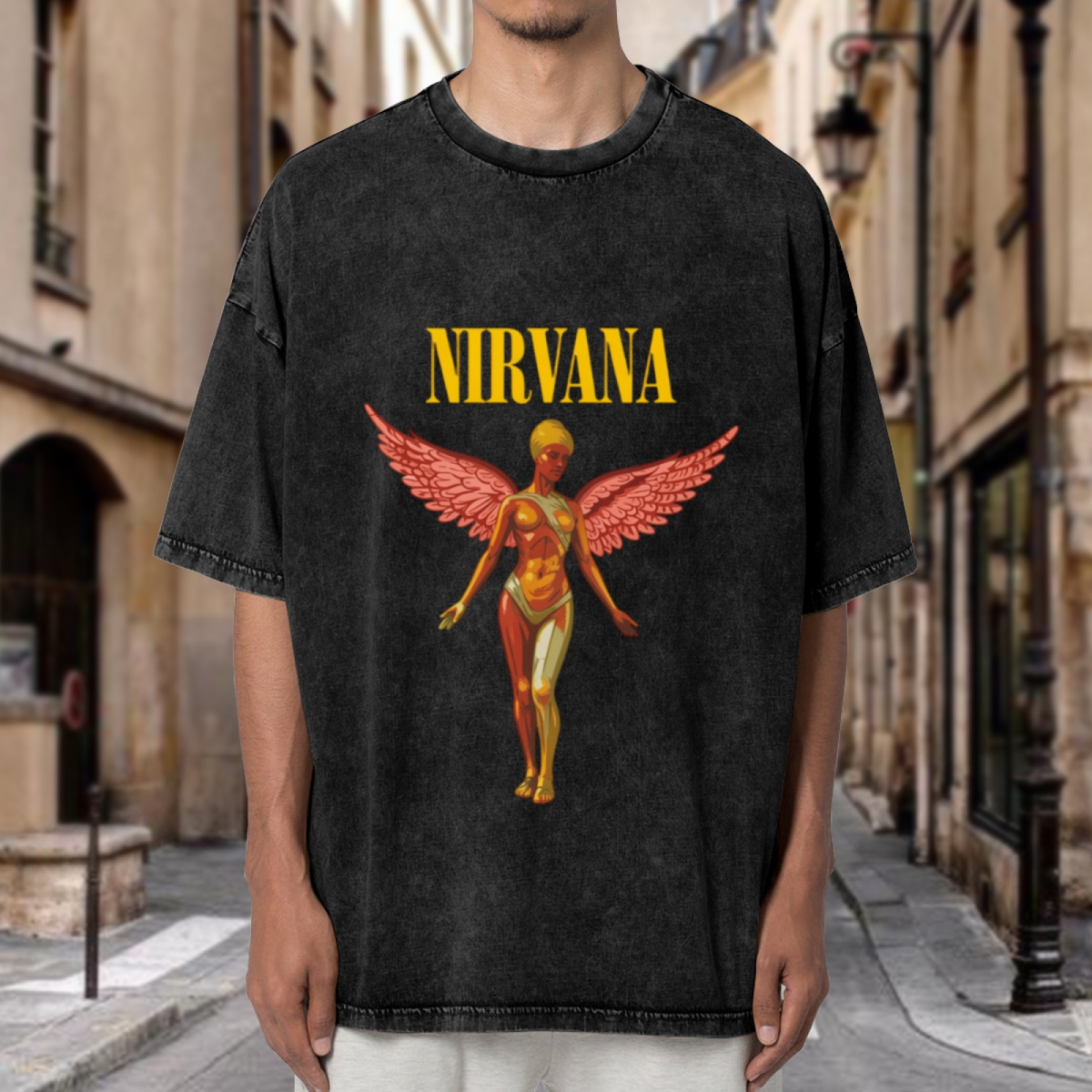 Nirvana In Utero Pink Angel Washed Tee in Black, product image showing a pink winged angel illustration based on the In Utero visual theme.
