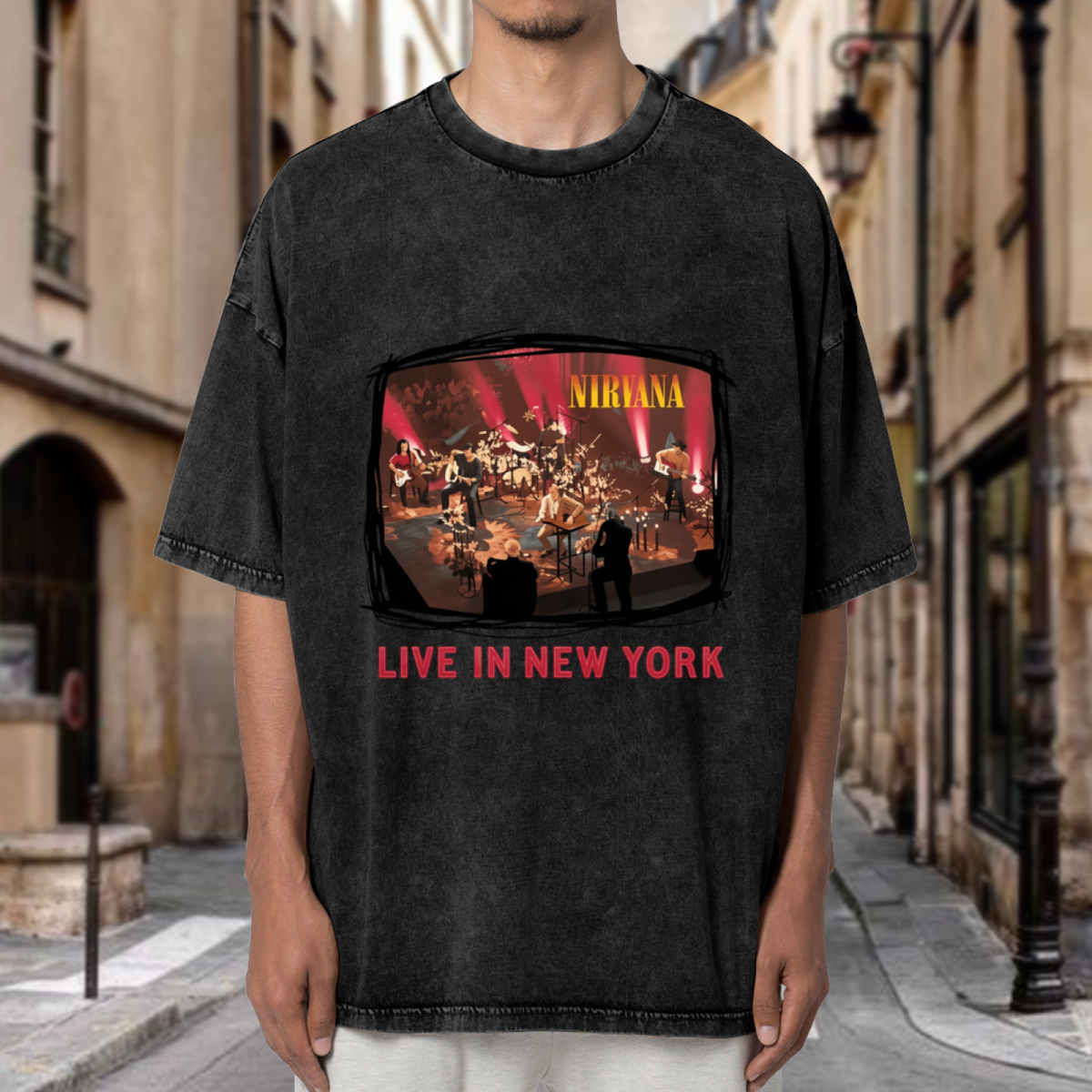 Nirvana Live in New York Washed Graphic Tee in Black, product image showing an acoustic concert-stage photograph referencing Nirvana’s New York live performance.